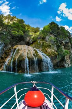  Pleasure boat with the red lantern. Travel to Provence. Waterfall in the river Verdon