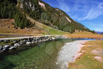 Headwaters of the famous Krimml waterfalls. The crystal clear transparent water glows in the midday sun. Austrian Alps