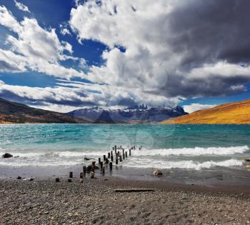  Storm clouds and strong winds in Laguna Azul. Boat dock on the lake. National Park Torres del Paine in Patagonia, Chile