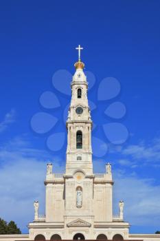 The grand memorial and religious complex in the small Portuguese town of Fatima. A huge tower, topped by a cross 