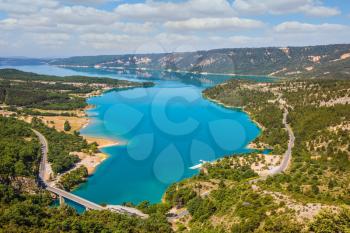 Picturesque lake with turquoise water among wooded hills. Canyon of Verdon, Provence, May

