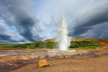 Famous geyser Strokkur in Iceland. Geyser erupts every few minutes