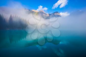 Misty autumn morning in the mountain Emerald Lake. Canada, Yoho National Park