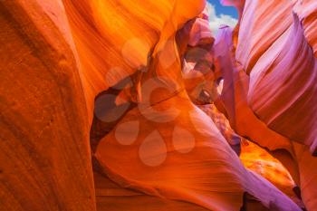 Fantastic slot-canyon Antelope in the Navajo reservation. Bright red and orange colored clay covered delightful magical light. Arizona, USA