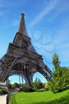 Touring Paris. Park at the foot of the Eiffel Tower. Unexpected angle fisheye lens takes
