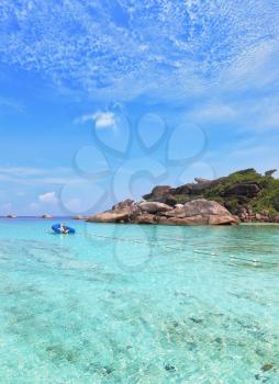 The picturesque shores of magical Similan Islands. Shallow beach with warm turquoise waters fenced enclosure rope with floats