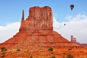 Fly over the valley huge balloons. Navajo Reservation in Arizona and Utah. Stone desert and rocks - mitts of red sandstone