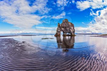 Stone mammoth Iceland. The picturesque cliff in Bay of Hoonah. Hvitserkur rocks during low tide at sunset