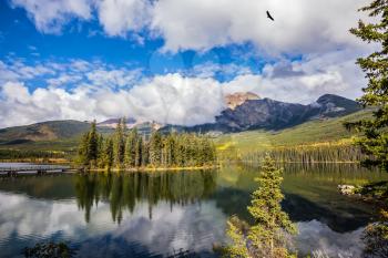 The clear autumn morning in Jasper National Park, Canada. Charming little island in the Pyramid Lake