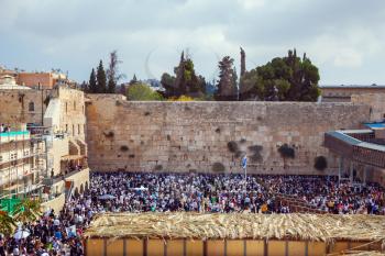 At Temple Square was a huge crowd of Jews. The Western Wall of the Temple. Autumn holiday of Sukkot in Jerusalem