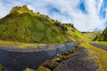 Scenic summer Iceland. The canyon Pakgil fast flowing shallow stream.  The photo was taken Fisheye lens