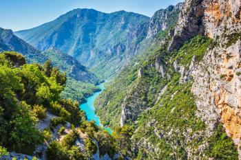 The largest alpine canyon Verdon spring. Emerald  river is flowing at the bottom of the gorge. Canyon of Verdon, Provence, France