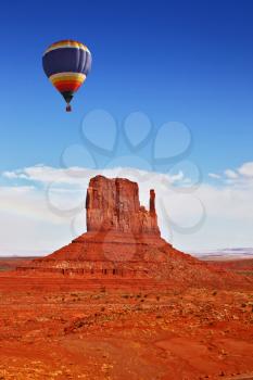 Fly over the valley one huge balloon. Navajo Reservation in Arizona and Utah. Stone desert and rocks - mitts of red sandstone