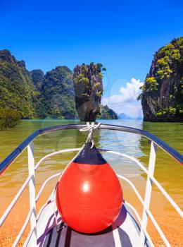 The holiday in Thailand. Bay in the Andaman Sea and tropical exotic island. A boat trip with a red lantern