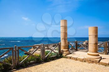 Ancient columns from the Roman period on the Mediterranean coast. National Park Caesarea, Israel