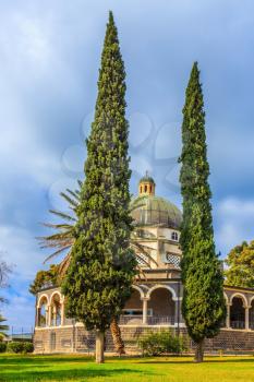 Catholic monastery and a small church Mount Beatitudes. Dome and colonnade surrounded by cypress. Israel, the shores of Lake Kinneret