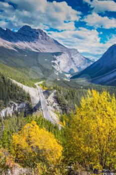 Canadian Rockies, Banff National Park. The picturesque canyon in sunny autumn day. At the edge of canyon takes excellent highway
