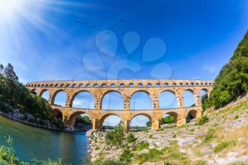  Provence, spring sunny day. Three-tiered aqueduct Pont du Gard - the highest in Europe. The bridge was built in Roman times on the river Gardon