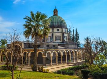 Catholic monastery and a small church Mount of Beatitudes. Beautiful park of cypress and palm trees. Israel, Sea of Galilee