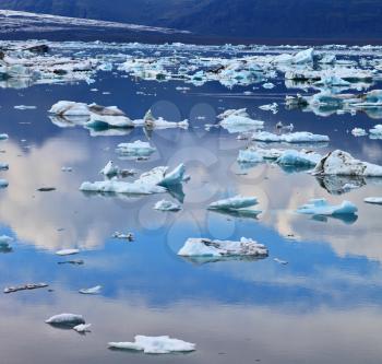 Transparent icebergs and ice floes in the Ice Lagoon Jokulsarlon. South-east Iceland in July