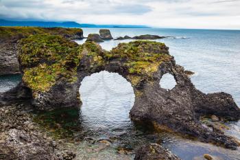 The fancy fantastic coastal cliffs Arnastapi. Travel to Iceland in the summer