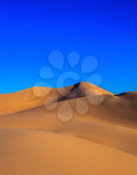 Sunrise in Mesquite Flat. Orange sand dunes in Death Valley, California