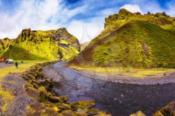 The photo was taken Fisheye lens. Camping in valley of canyon Pakgil. The canyon flowing fast shallow creek. Summer blooming Iceland