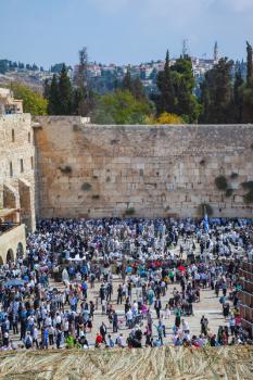 Autumn holiday of Sukkot in Jerusalem. The western wall of the Temple. Huge crowd of Jews gathered for prayer on the square