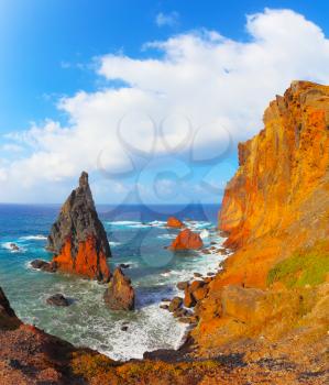 Arid eastern tip of the island of Madeira. Colorful pinnacles lit sunset. Atlantic storms