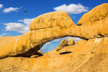 Stone arch Spitzkoppe, Namibia. Mountain Nature Reserve in the desert. The concept of extreme and ecological tourism
