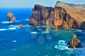 Atlantic storms. Arid eastern tip of the island of Madeira. Colorful pinnacles lit sunset 