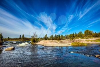 Thin cirrus clouds and foam water rapids on the Winnipeg River. Trend of travel Around the World. Old Pinawa Dam Provincial Heritage Park