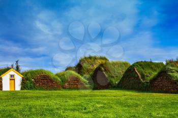 The village first settlers in Iceland. The reconstituted village - Pioneer Museum - Viking. Roofs of houses covered with grass