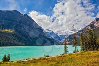 Magnificent Lake Louise is surrounded by mountain and glaciers. Rocky Mountains, Canada, Banff National Park. Great day