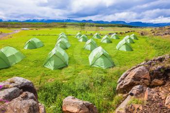 July in Iceland. Green tent on a grassy lawn Boy Scout camp