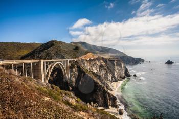 Scenic arch bridge - viaduct runs along the Pacific coast. California State Route 1. USA