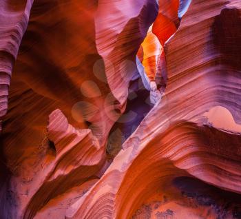 Arizona, USA. Fantastic slot canyon Antelope in the Navajo reservation. Mysterious purple - red tunnel and blue sky