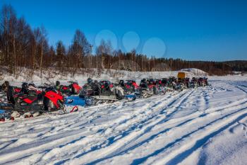 Travel to Lapland. The first trip on snowmobiles in special suits. The concept of active and extreme tourism
