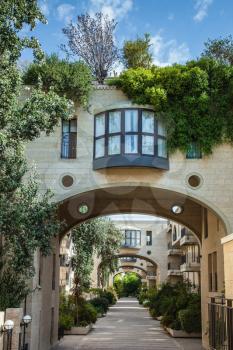 Elegant arched passageway between buildings. Jerusalem, Israel