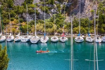  White sailboats moored in rows near the shore. Small fjords in Calanque National Park between Marseille and Cassis
