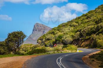 The scenic road on the famous Cape of Good Hope in the Atlantic. Travel to South Africa. The concept of active tourism and recreation
