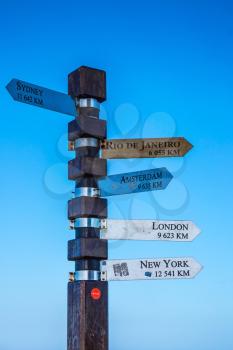 Cape of Good Hope, South Africa. Pillar with pointers of distances to different cities of the Earth