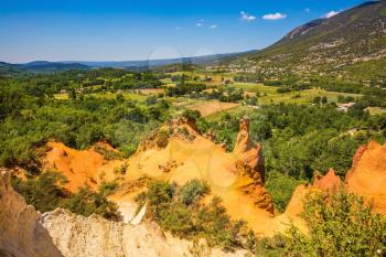 The reserve - pit on production ochre. Orange and red picturesque hills. Languedoc - Roussillon, Provence, France