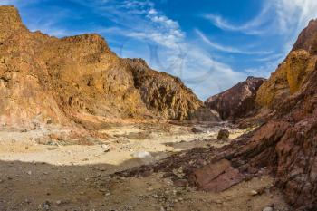  Israeli warm winter. Picturesque and multi-color Black canyon in ancient Eilat mountains