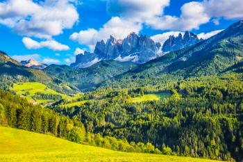 Warm autumn in  the Val de Funes, Dolomites. The concept of ecological tourism. The valley in Tirol is surrounded by a dentate wall of dolomite rocks