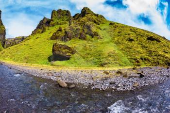 Scenic summer Iceland. The canyon Pakgil fast flowing shallow stream.  The photo was taken Fisheye lens