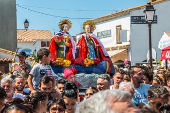 Saintes-Maries-de-la-Mer, France - May 25, 2015. Religious feast in honor of the Holy Maries in Provence. The concept of ethnographic tourism. Christians accompany two statues of the Holy Mary
