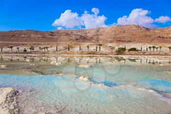 Reduced water in the very salty Dead Sea. The evaporated salt. Dead Sea, Israel. The concept of medical and ecological tourism