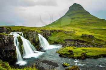 The most famous mountain in Iceland is Kirkjoufell. At the foot of the mountain cascading waterfalls Kirkjoufellfoss. The concept of exotic and extreme tourism
