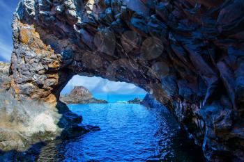 Concept of exotic and ecological tourism. Magic travel on the fantastic island of Madeira. Rocks, bays and grottoes at coast of Atlantic